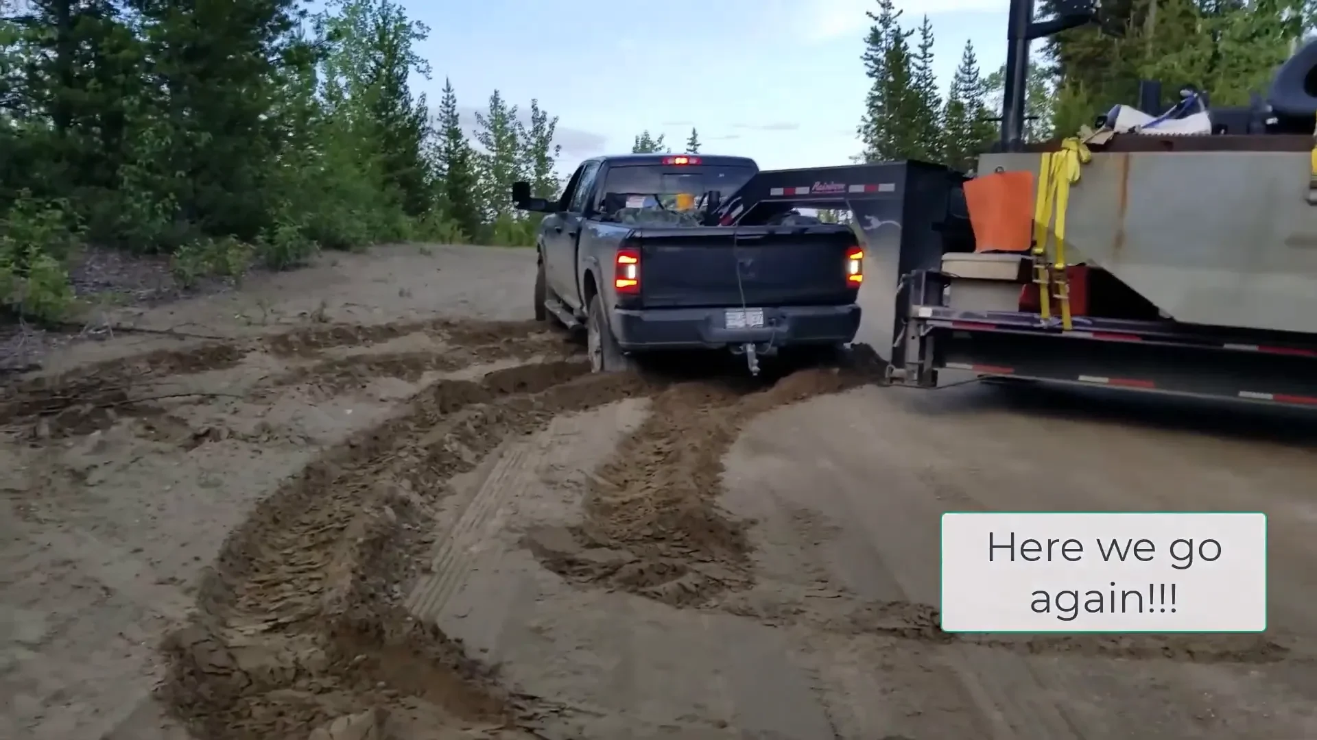 Truck and trailer stuck in deep silt.