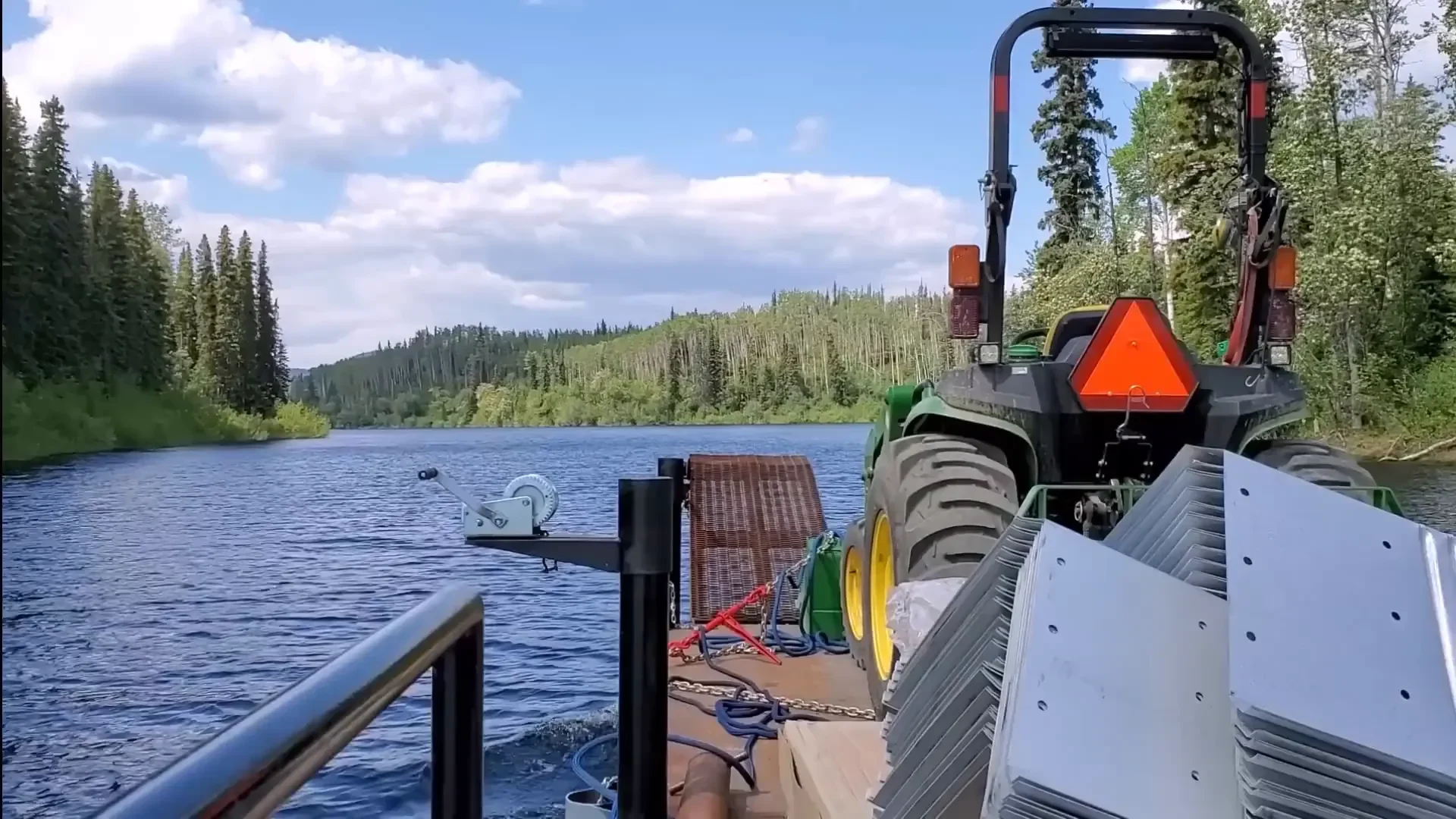 Clearing land lakeside cabin - loading heavy materials onto the barge