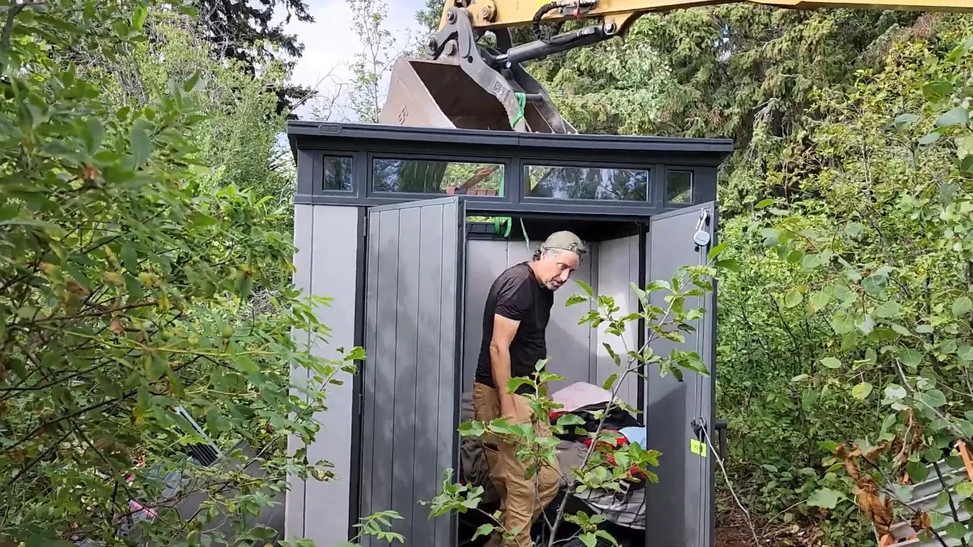 Amazing shed move - preparing to move the shed with an excavator
