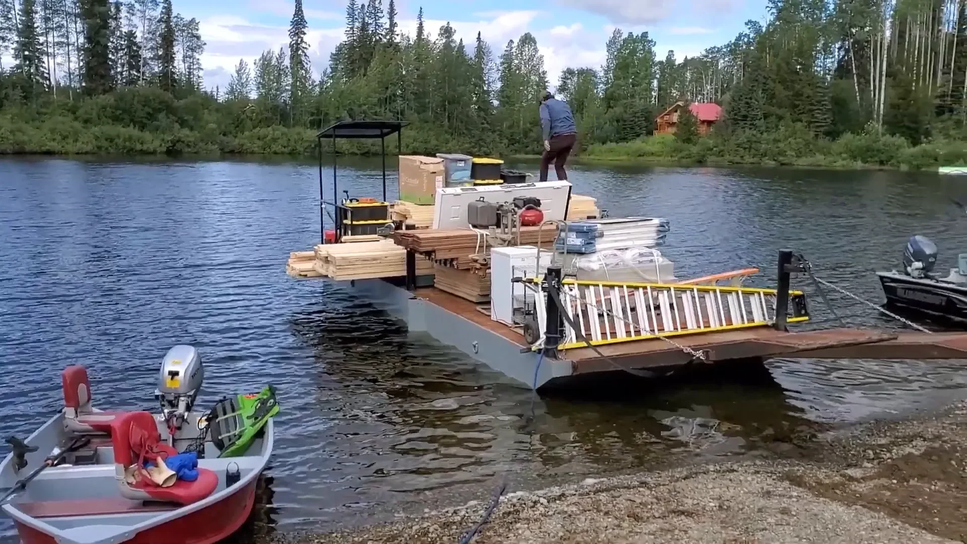 Big trouble at the island - loading lumber onto the barge