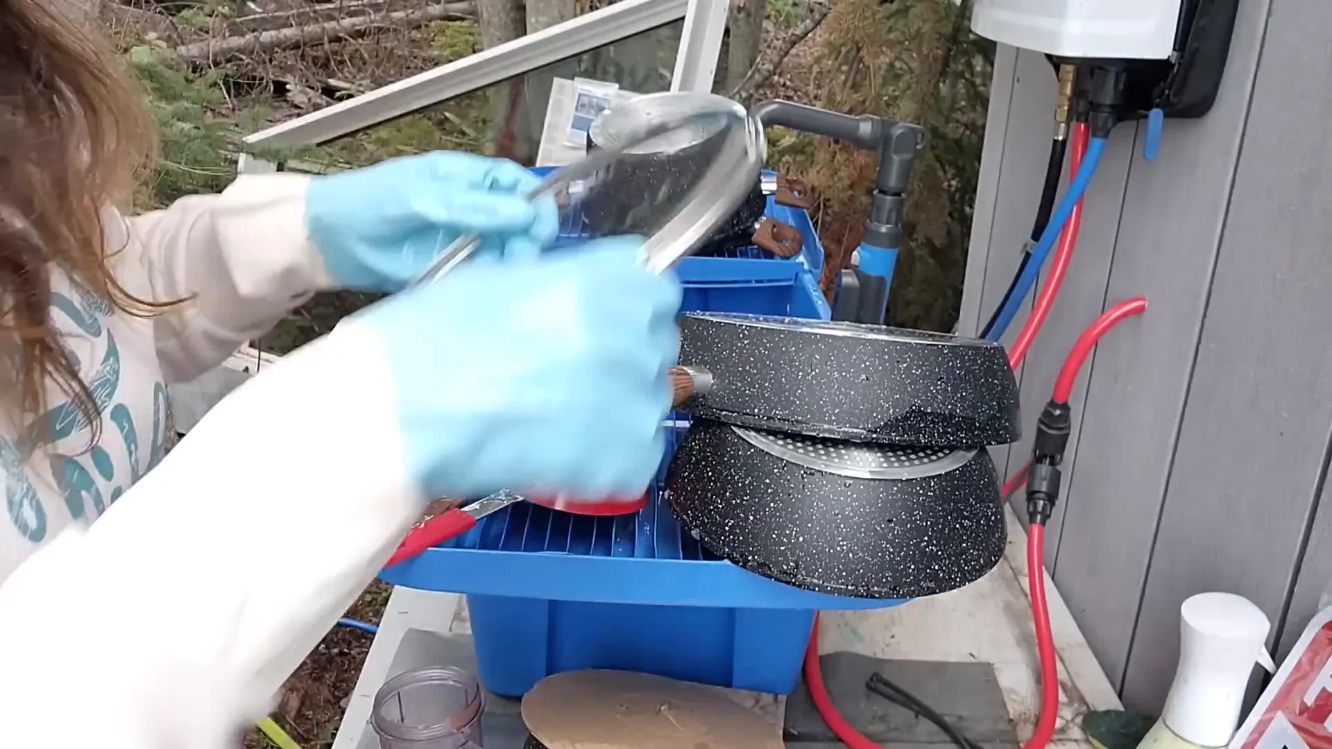 Building Our Island Homestead: A Rewarding Challenge - S2 Ep33 1 Woman washing dishes outside in the forest