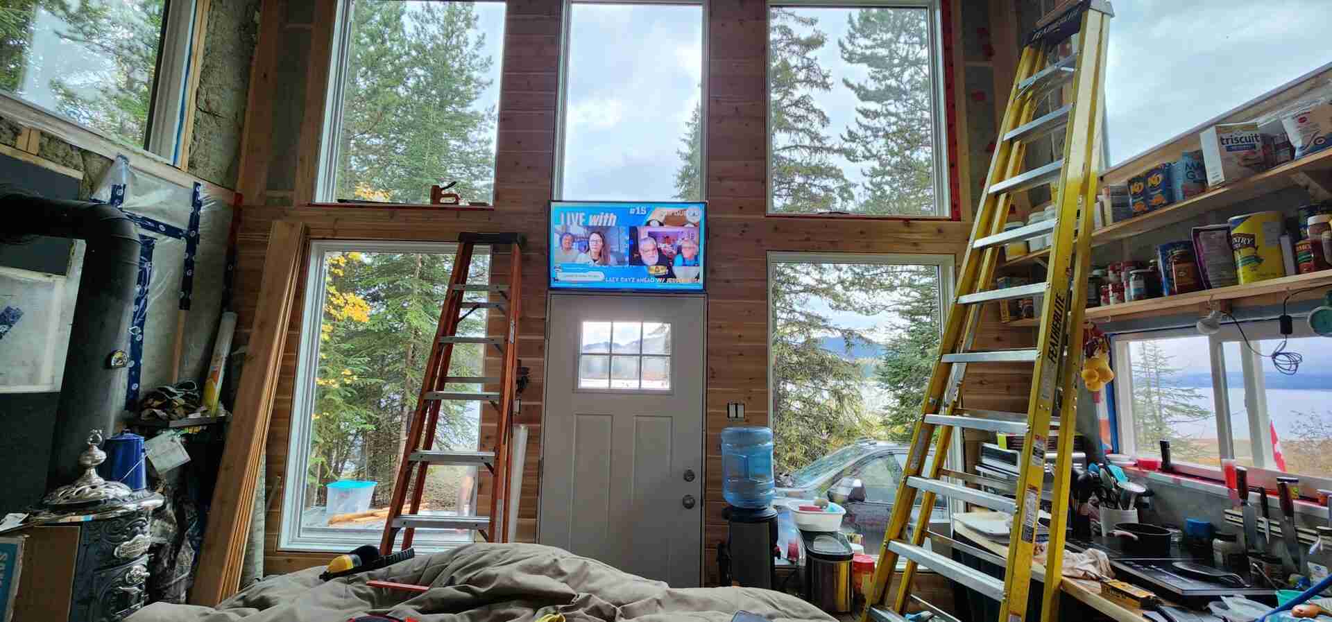 Two ladders against the walls in a tiny cabin