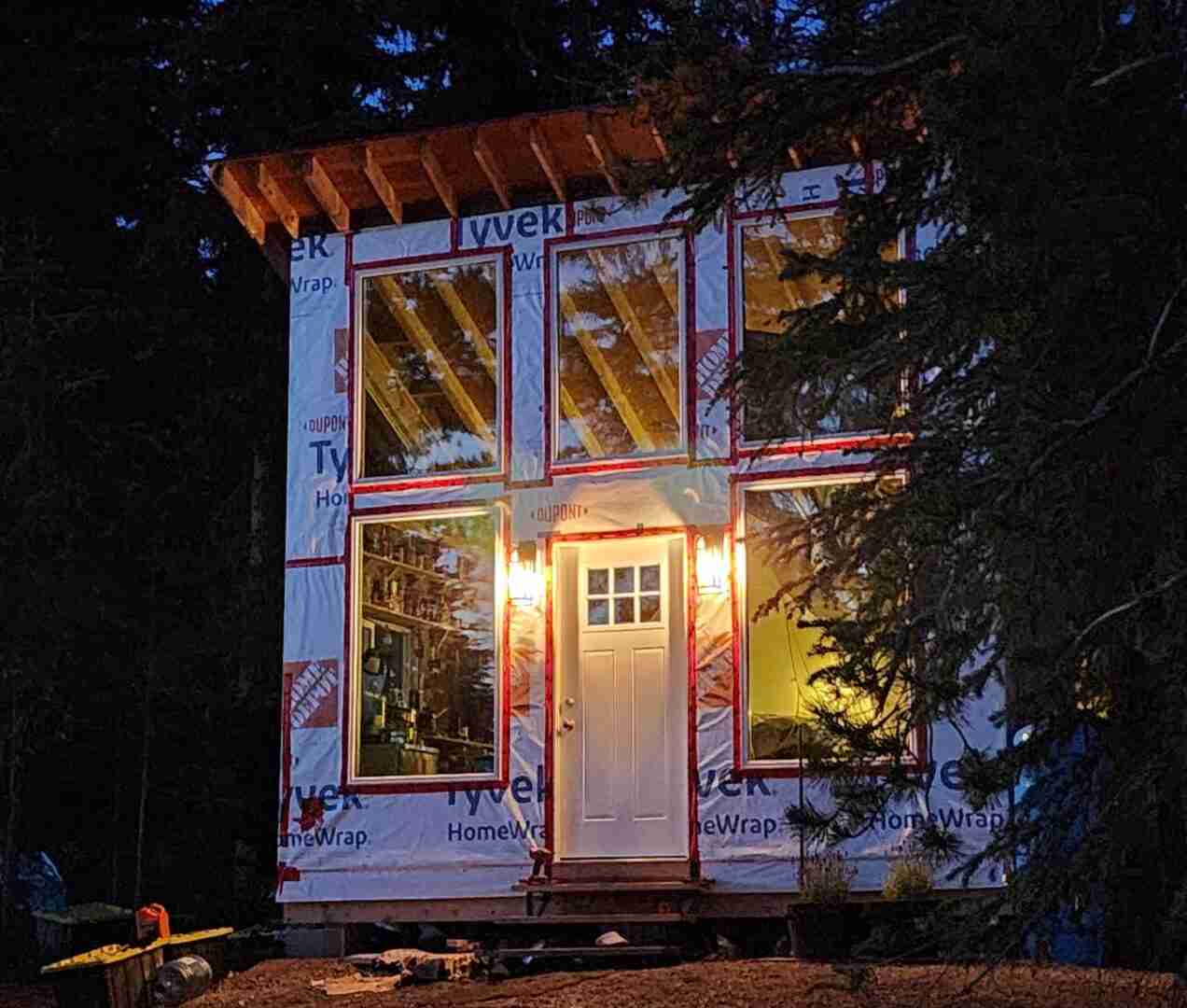 Night view of tiny cabin at bird island - windows in, no siding up