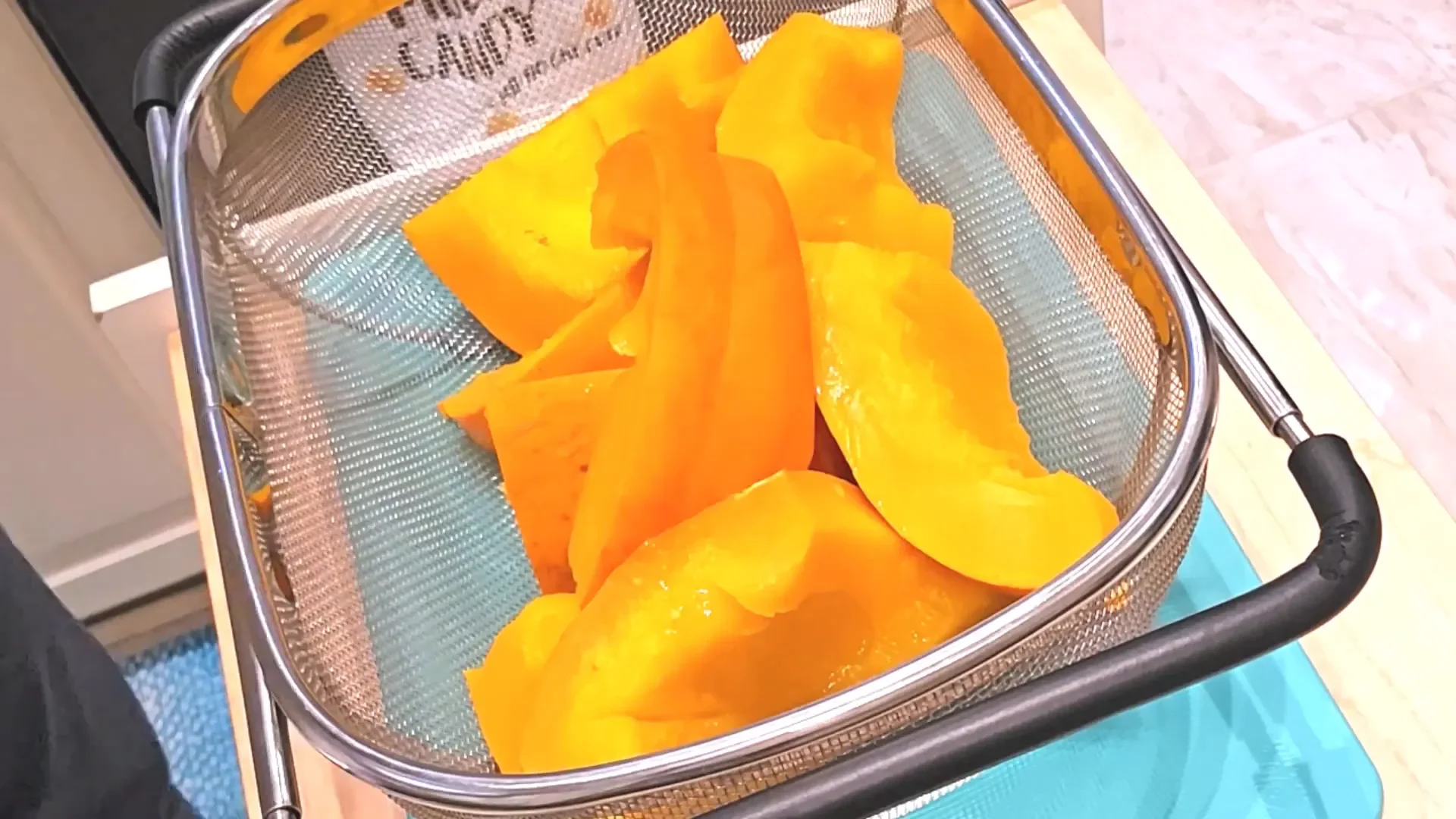 Straining the pumpkin after steaming