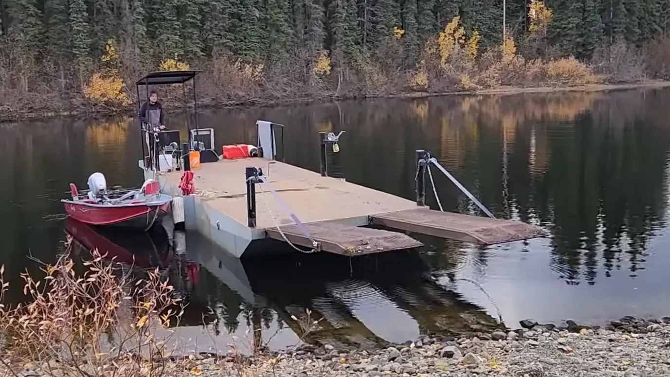 Loading supplies onto the barge for a supply run.