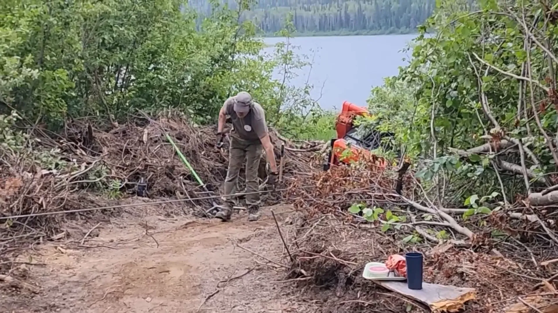 This is Our Toughest Task So Far - Will We Succeed? - S2 Ep26 5 A man checks the tension on a winch line while setting up for a recovery pull