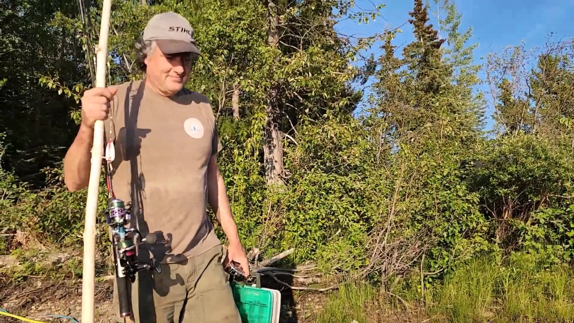 Off Grid Cooking: Simple, Succulent Rainbow Trout! - S2 Ep25 2 A man carries fishing gear down to his boat