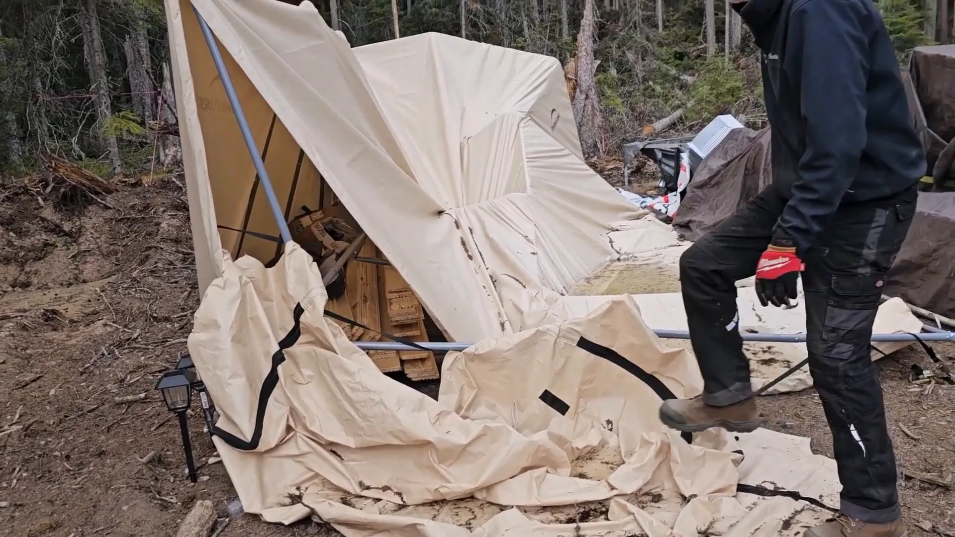 Off-Grid Island Winter Damage: What’s Still Standing? | S3 Ep2 5 A man surveys a destroyed canvas shelter on his off-grid island