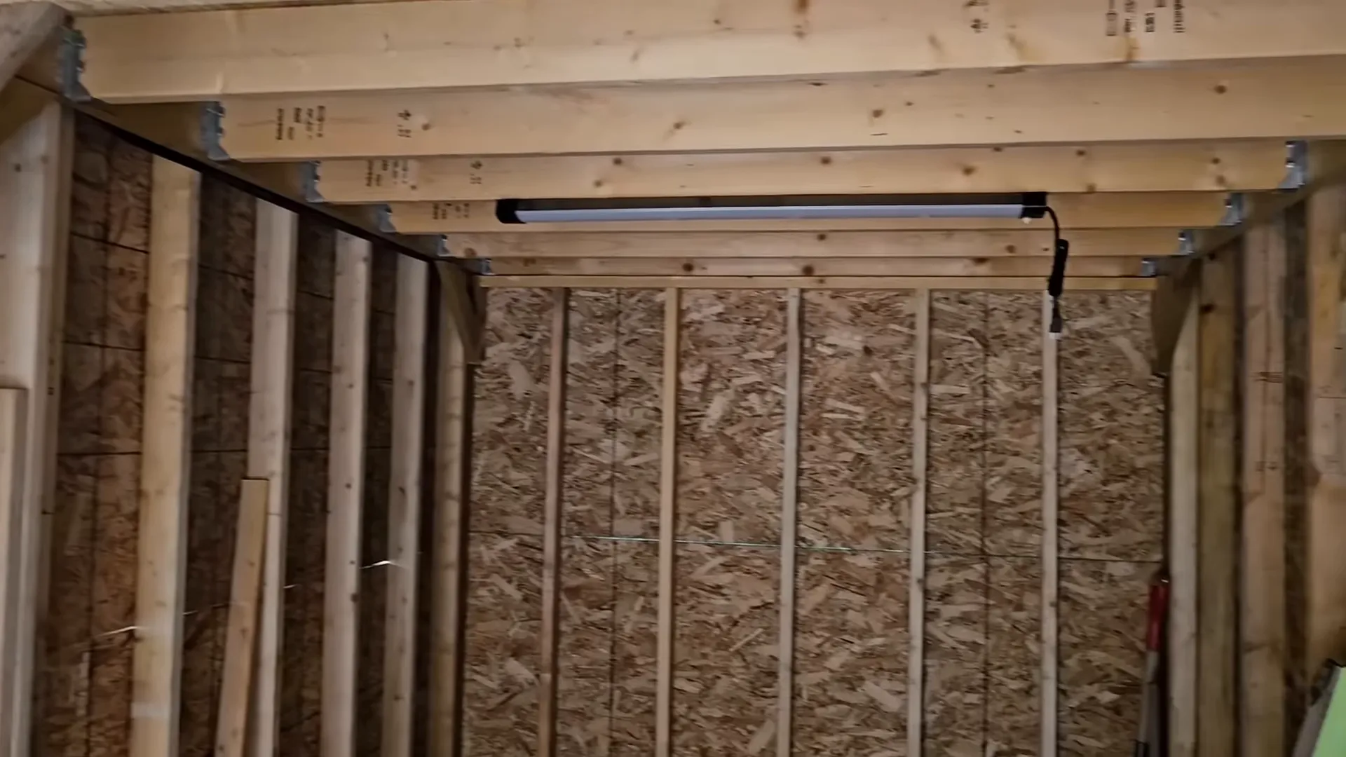 Inside the storage area with hinges and space for shelving