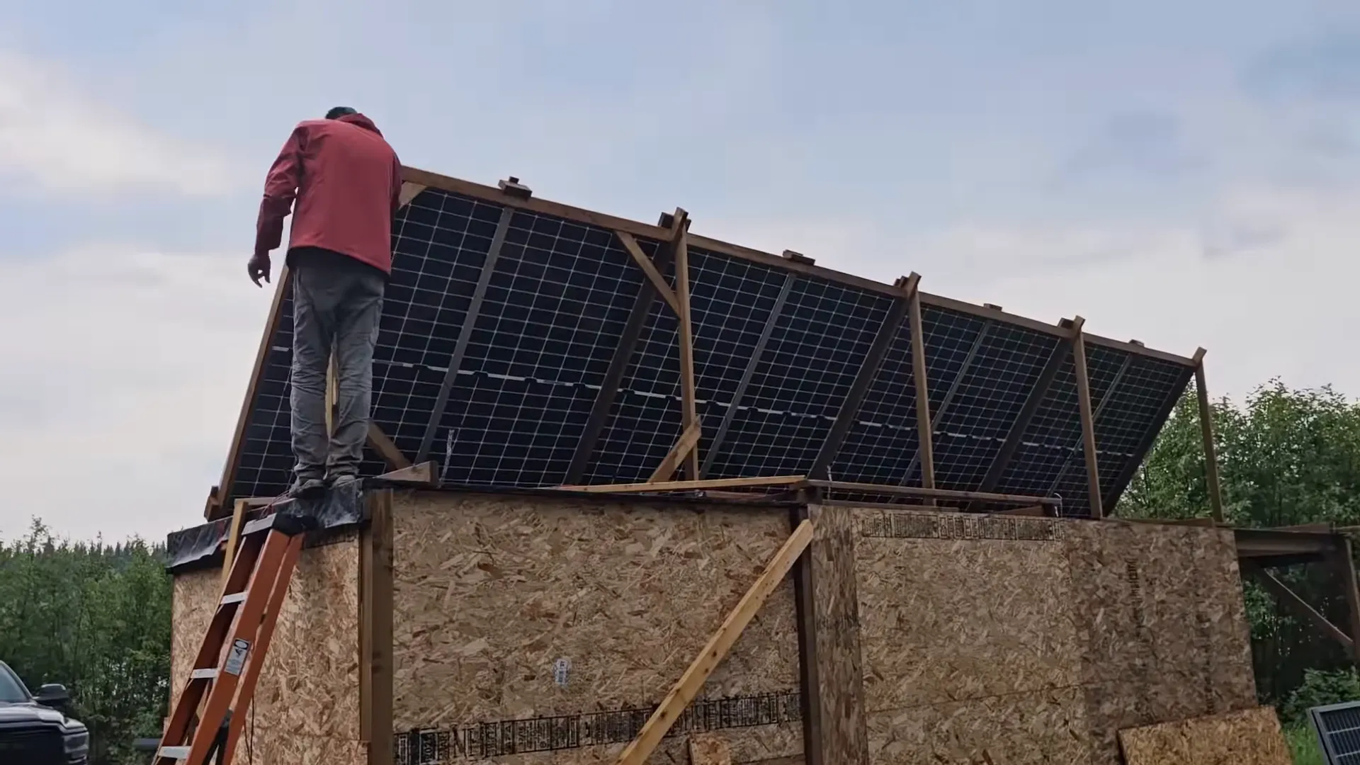 Levering the array and sliding flashing into place