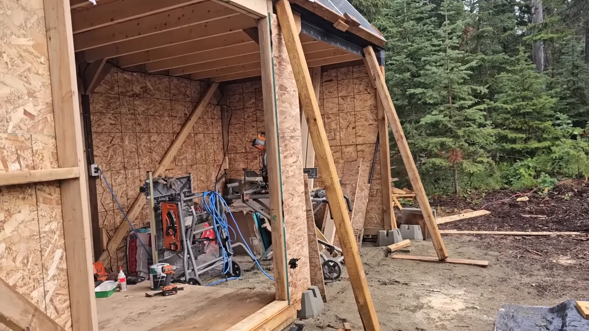 Ryan with the large wooden door used as leverage for moving the array