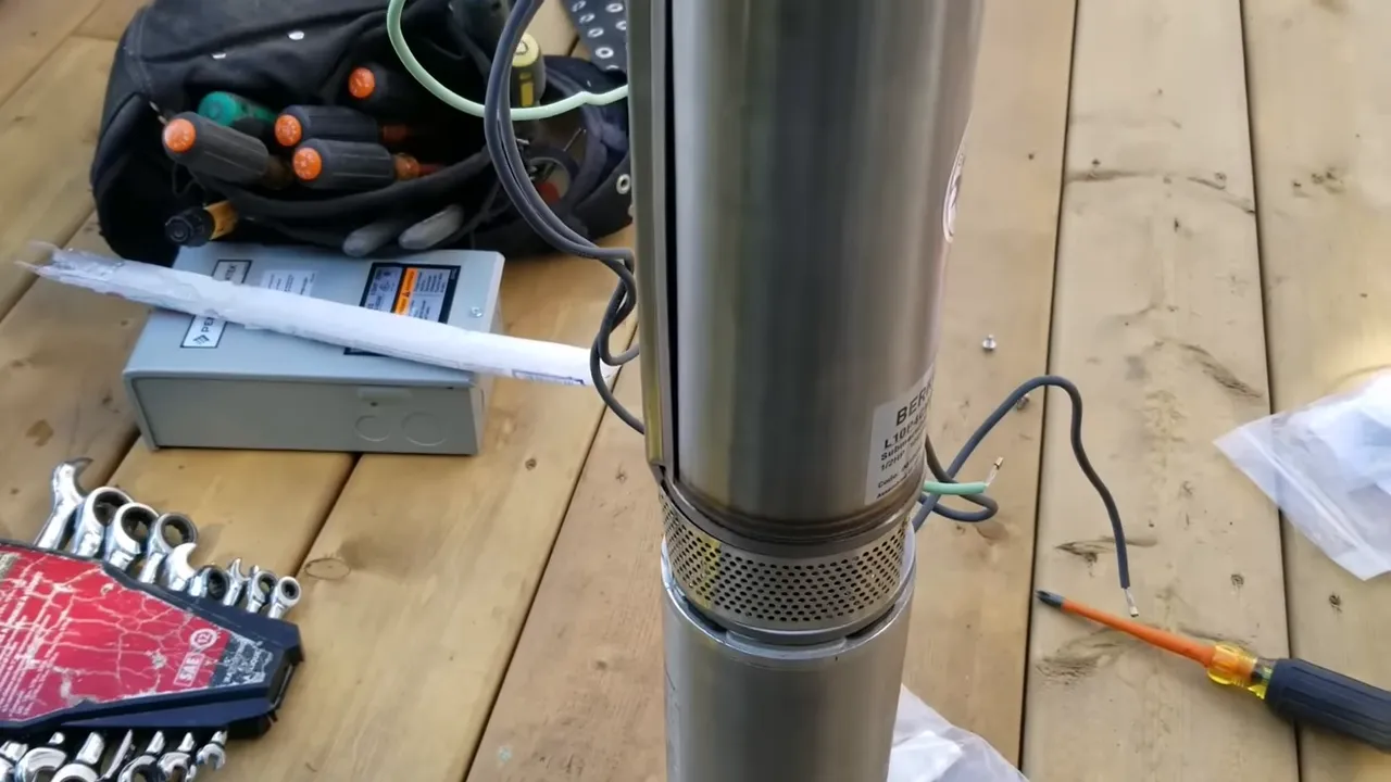 Off grid life: how we built our safe water system on our remote island - pump connected to motor