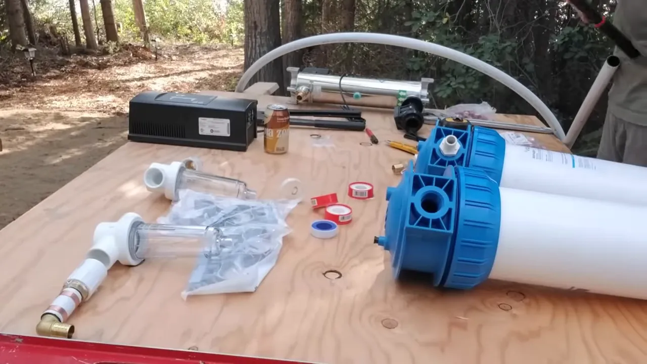 Off grid life: how we built our safe water system on our remote island - system layout on plywood