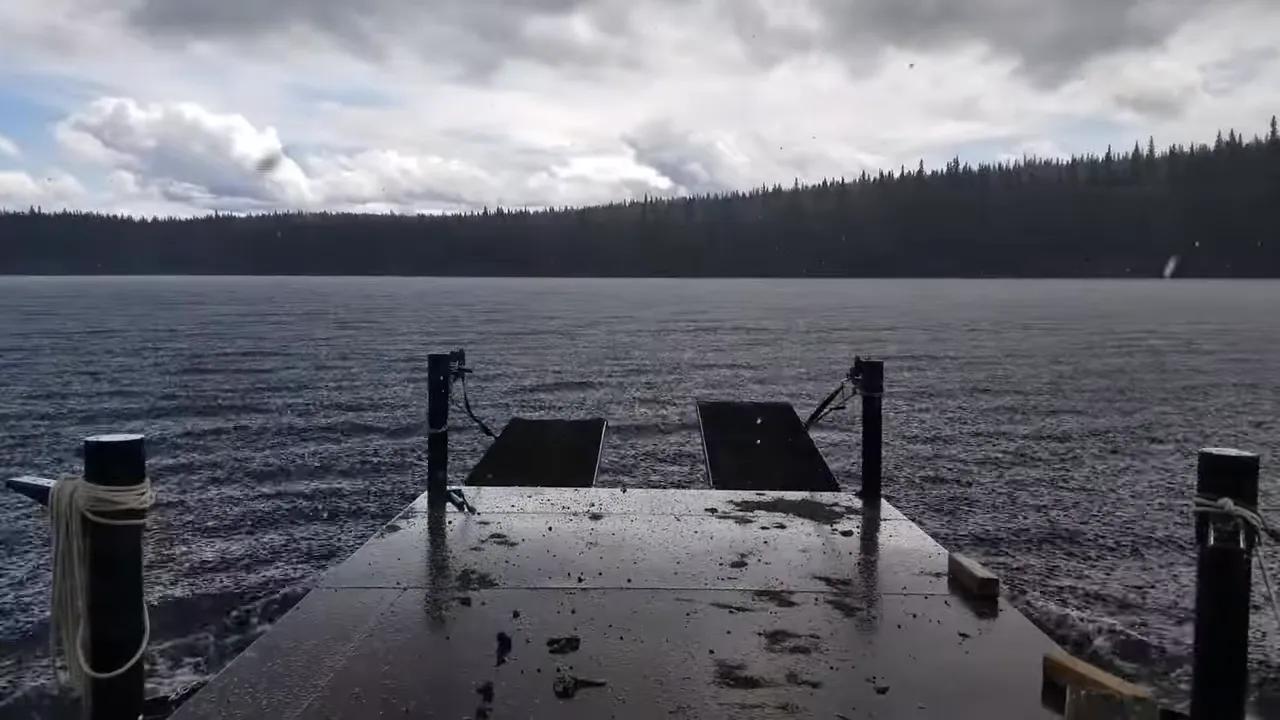 Off grid life on a remote island in canada – solar power, swamped boat & beating the storm - storm clouds over the lake