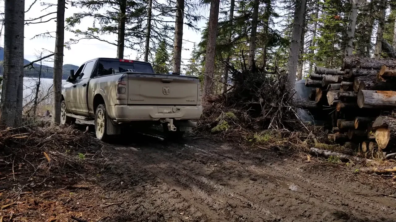 Off grid life on a remote island in canada – solar power, swamped boat & beating the storm - truck backed off barge on shore
