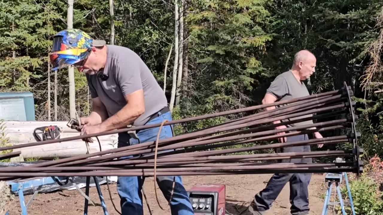 Welding the anchor for a huge solar tracker - gil welding the anchor with a clear sky
