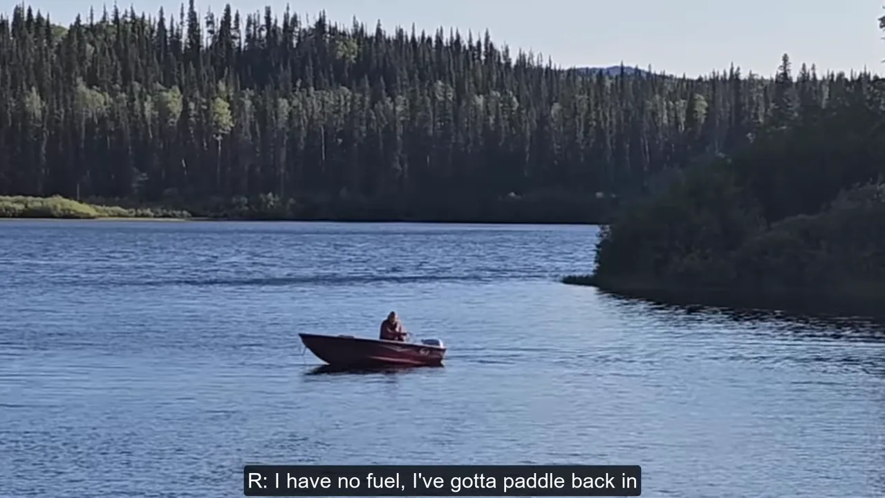 Red motorboat stranded mid-lake with a person looking into the boat; on-screen subtitle reads 'r: i have no fuel, i've gotta paddle back in'.